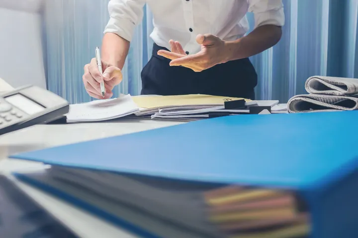 New York personal injury lawyer preparing a case file, gathering evidence to negotiate maximum compensation.
